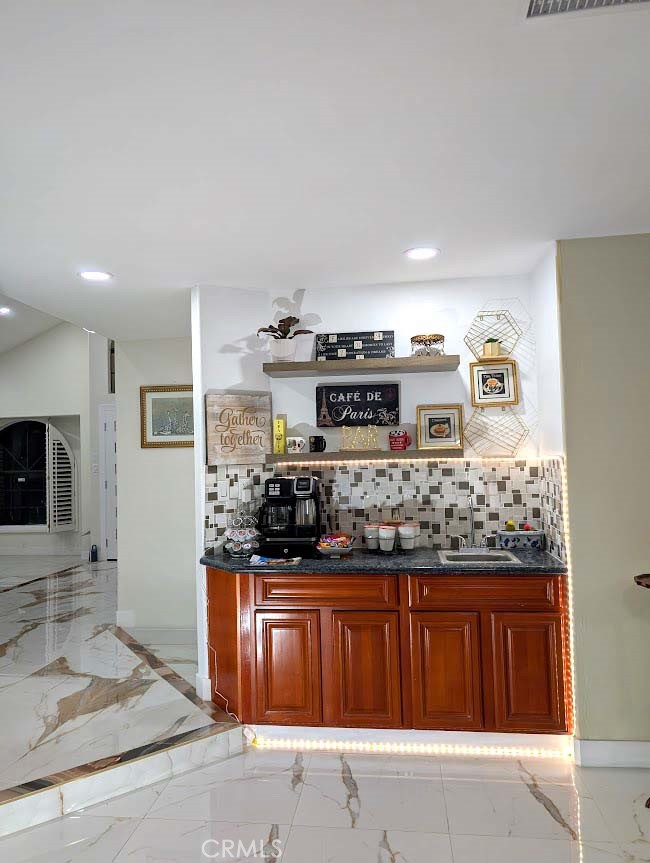 10452 Circulo De Juarez Fountain Valley, CA 92708 - Photo 17 of 34 a kitchen with stainless steel appliances granite countertop a stove and a refrigerator