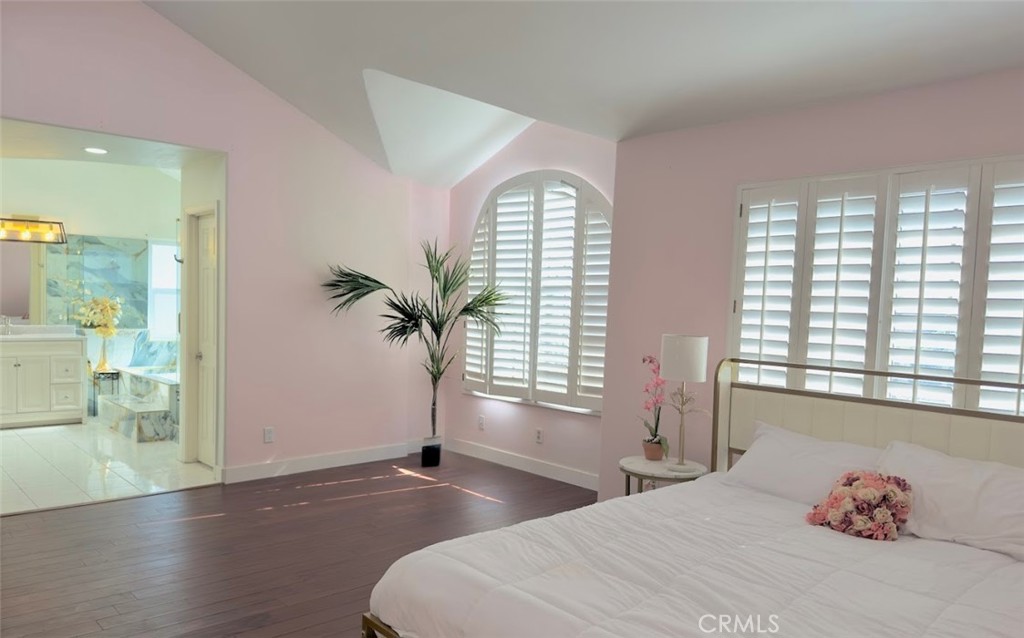 10452 Circulo De Juarez Fountain Valley, CA 92708 - Photo 23 of 34 a bedroom with a bed and window