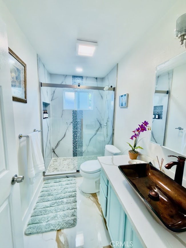 10452 Circulo De Juarez Fountain Valley, CA 92708 - Photo 24 of 34 a bathroom with a sink and a mirror