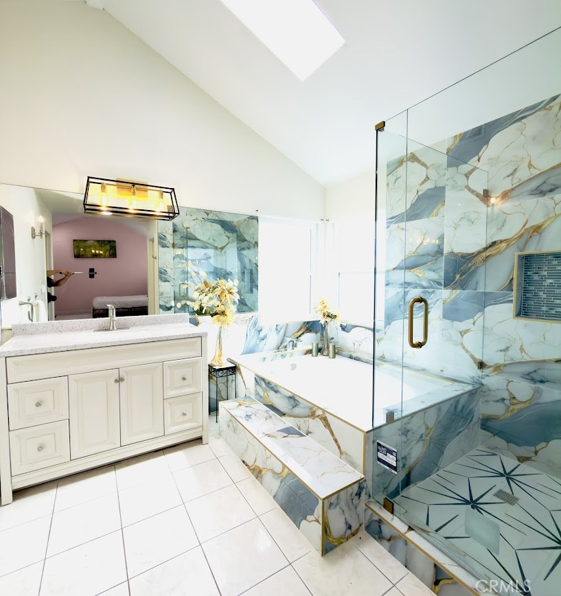 10452 Circulo De Juarez Fountain Valley, CA 92708 - Photo 25 of 34 a spacious bathroom with a double vanity sink and a mirror