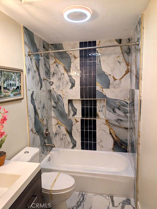 10452 Circulo De Juarez Fountain Valley, CA 92708 - Photo 28 of 34 a bathroom with a toilet and shower