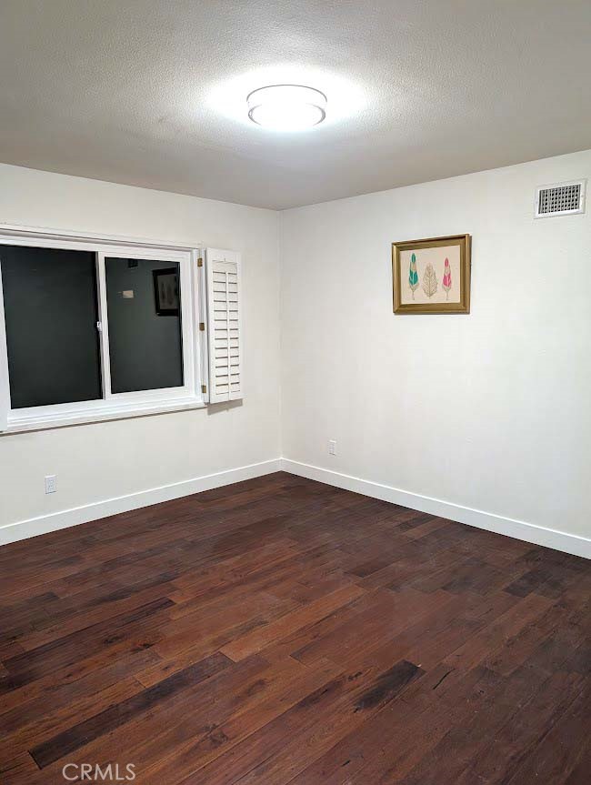 10452 Circulo De Juarez Fountain Valley, CA 92708 - Photo 29 of 34 a view of an empty room with wooden floor