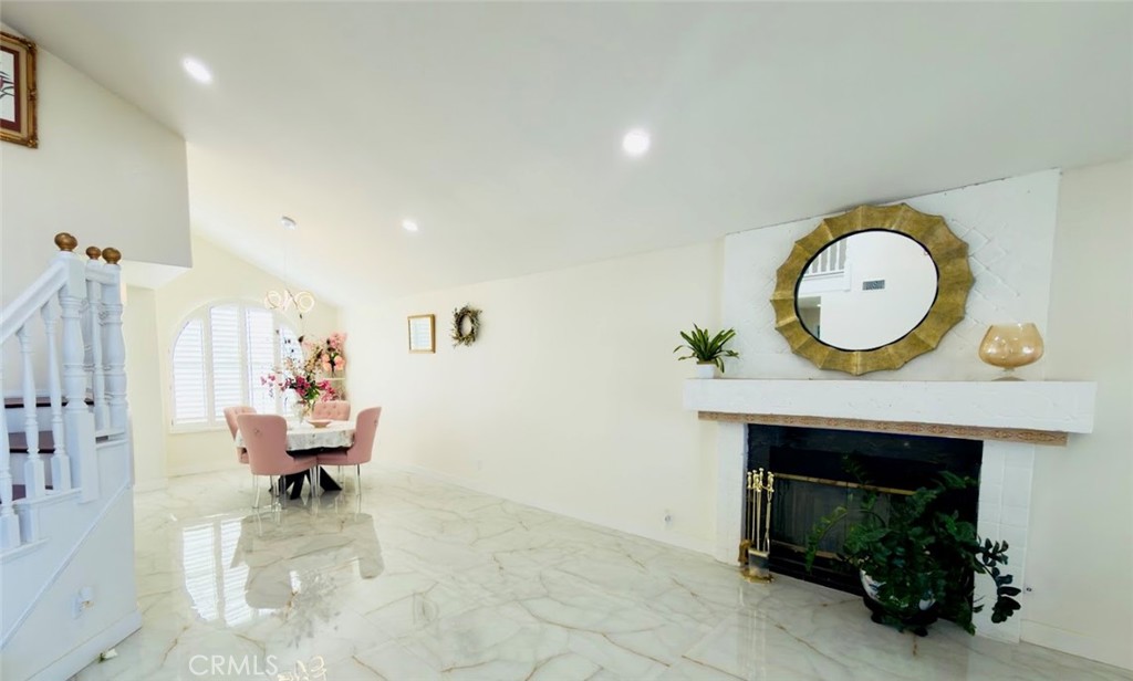 10452 Circulo De Juarez Fountain Valley, CA 92708 - Photo 5 of 34 a living room with furniture and a fireplace