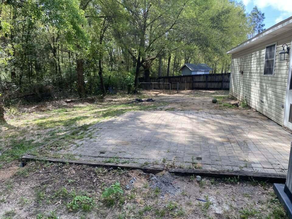 12 Flora Cove Crestview, FL 32539 - Photo 16 of 16 a view of a backyard with large trees