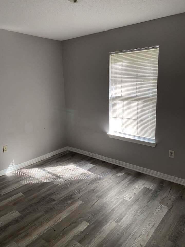 12 Flora Cove Crestview, FL 32539 - Photo 7 of 16 wooden floor in an empty room with a window