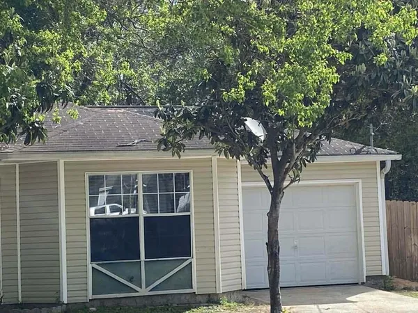 a house with a tree in front of it