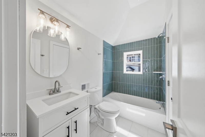 33 Clinton Place Morristown, NJ 07960 - Photo 13 of 24 a bathroom with a sink a toilet and shower