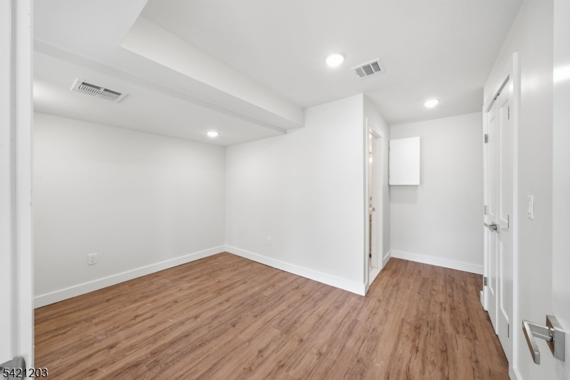 33 Clinton Place Morristown, NJ 07960 - Photo 14 of 24 a view of a room with wooden floors