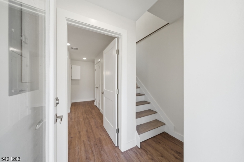 33 Clinton Place Morristown, NJ 07960 - Photo 17 of 24 a view of a hallway with wooden floor and entryway