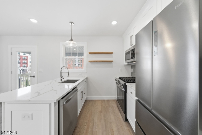33 Clinton Place Morristown, NJ 07960 - Photo 5 of 24 a kitchen with a sink stove and refrigerator