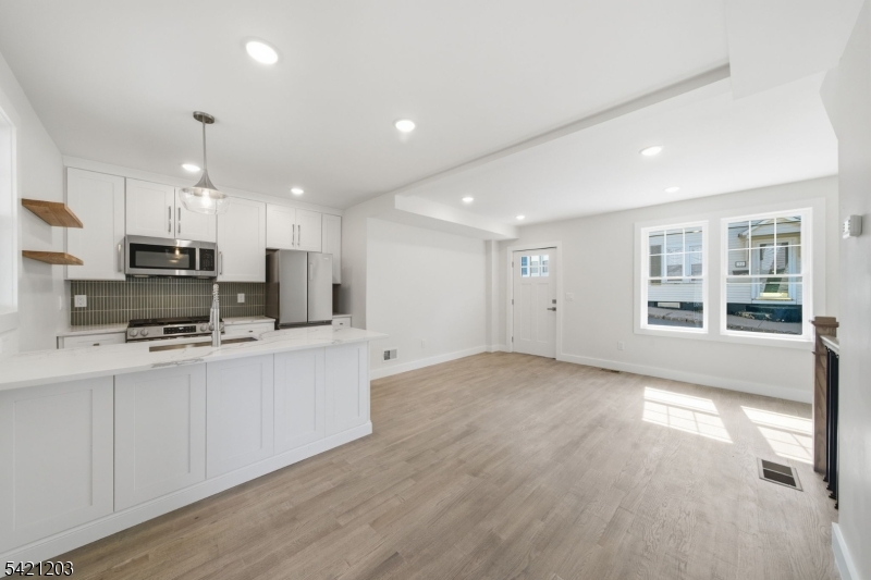 33 Clinton Place Morristown, NJ 07960 - Photo 7 of 24 a kitchen with stainless steel appliances a refrigerator sink and microwave