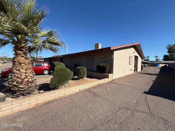 a picture of a house with a street