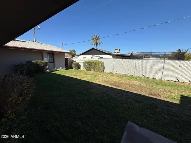 a view of a big yard with an outdoor space