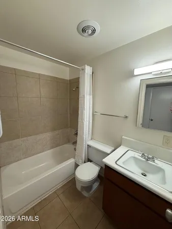 a bathroom with a sink a toilet and a bathtub