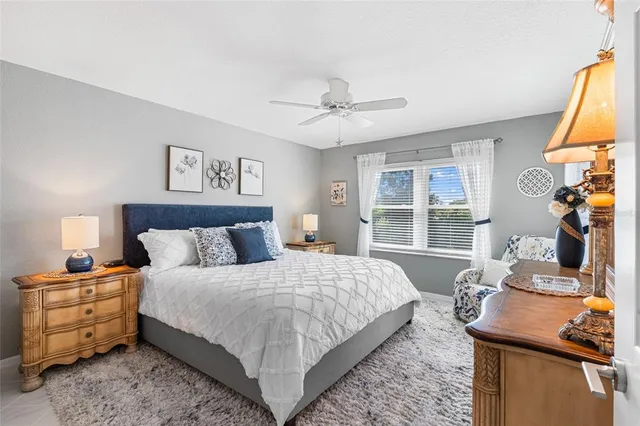 a bedroom with a large bed and a window