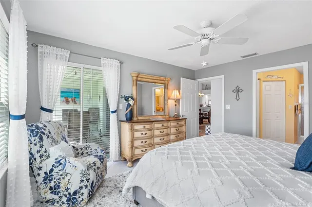 a bathroom with a granite countertop sink mirror and toilet