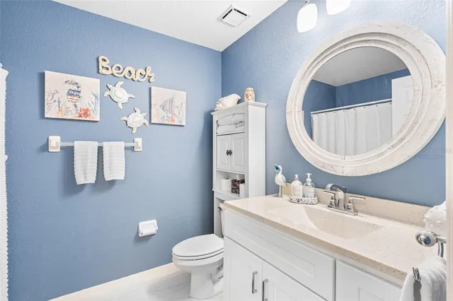a bathroom with a sink a vanity and a mirror