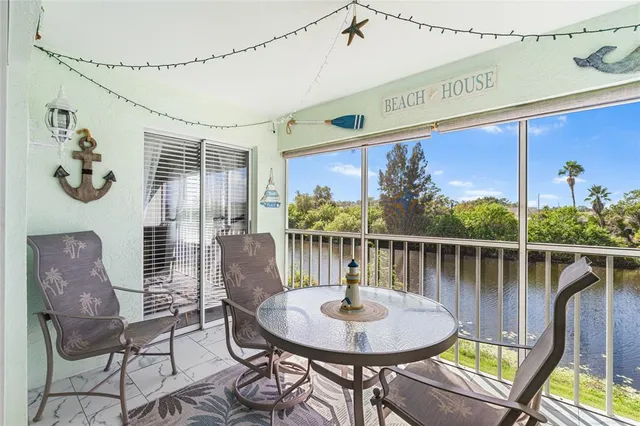 a dining room with furniture a rug and wooden floor