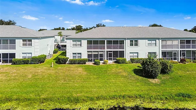 an aerial view of a house with yard swimming pool and outdoor seating