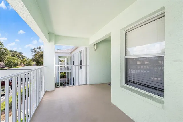 a view of balcony with furniture