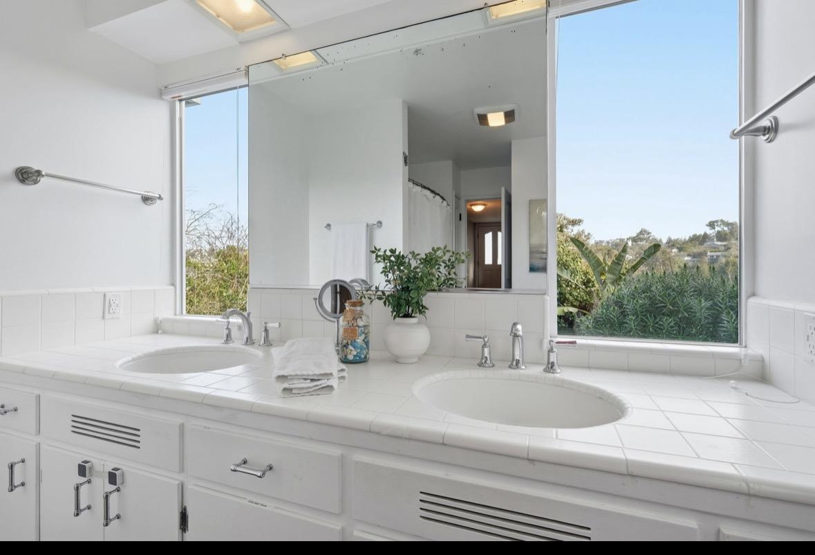229 Rio Del Mar Boulevard Aptos, CA 95003 - Photo 19 of 27 a bathroom with a sink and a mirror