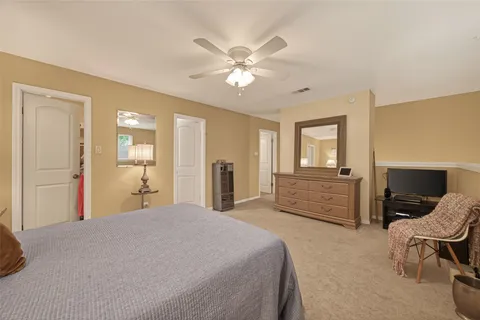 a bedroom with bed and window