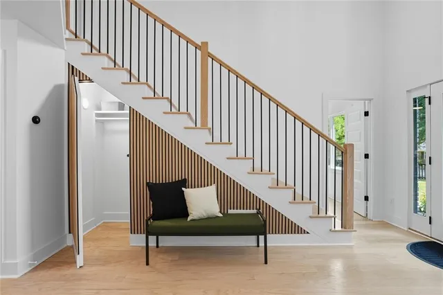 a view of entryway with wooden floor and stairs