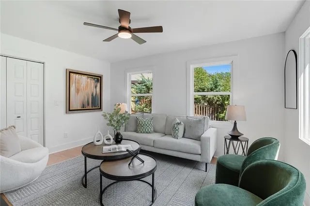 a living room with furniture and a large window