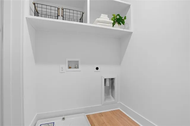 a view of room with window and wooden floor