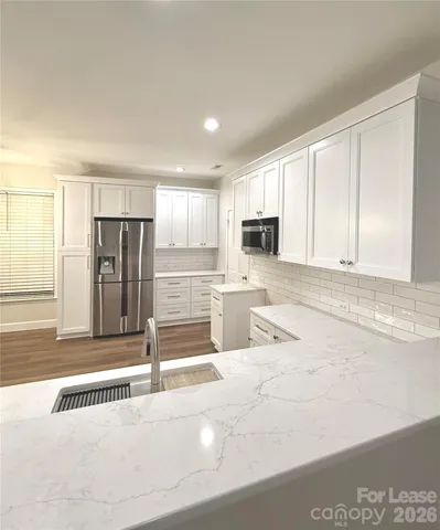 a bathroom with a bathtub and toilet