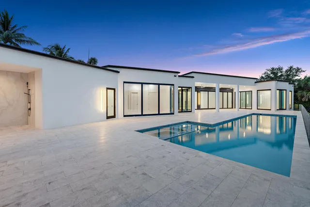 a bathroom with a double vanity sink and mirror