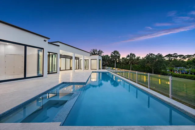 a bathroom with a granite countertop sink vanity and mirror