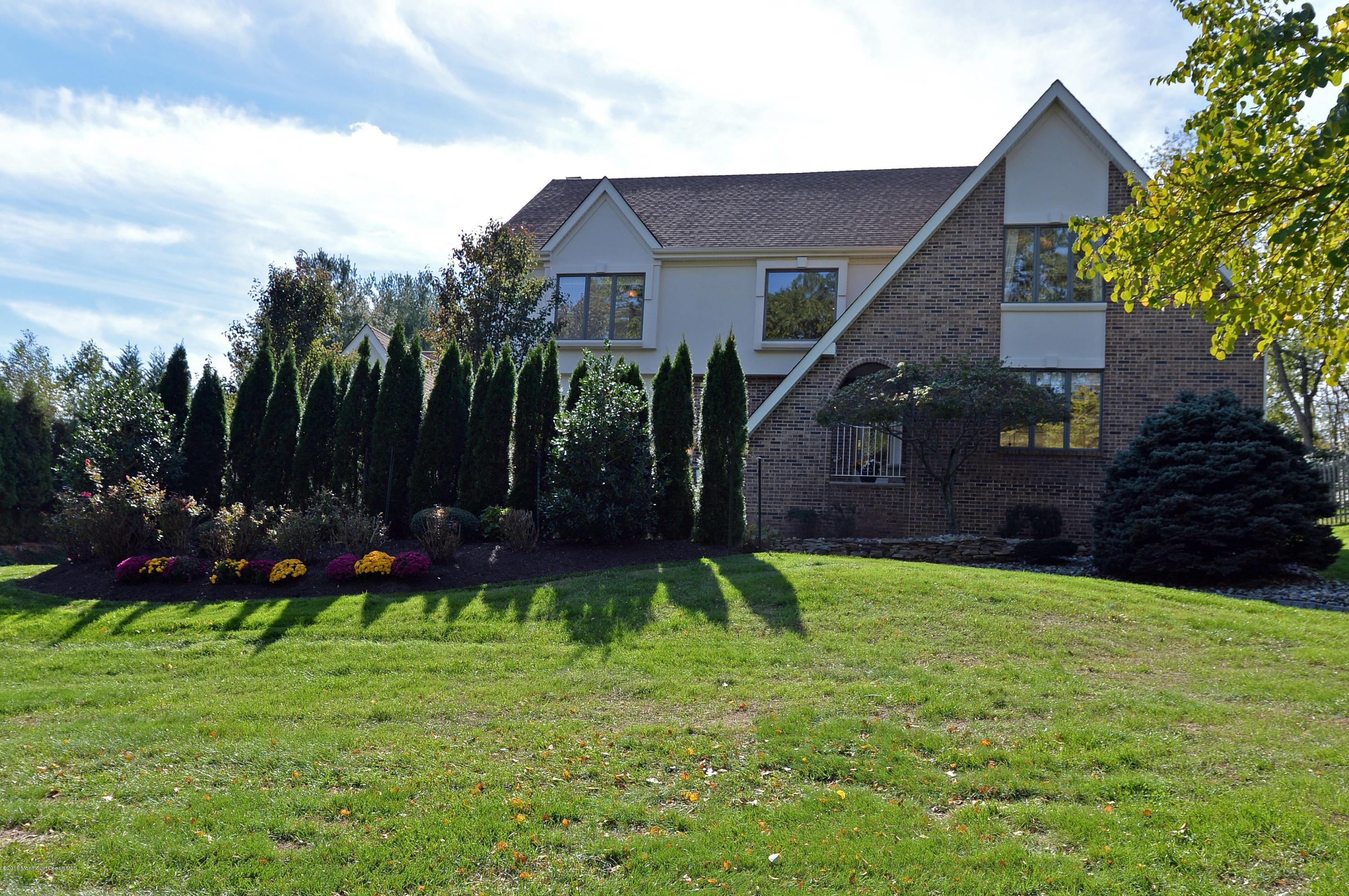 490 Burlington Road Freehold, NJ 07728 - Photo 1 of 34 a view of a back yard of the house