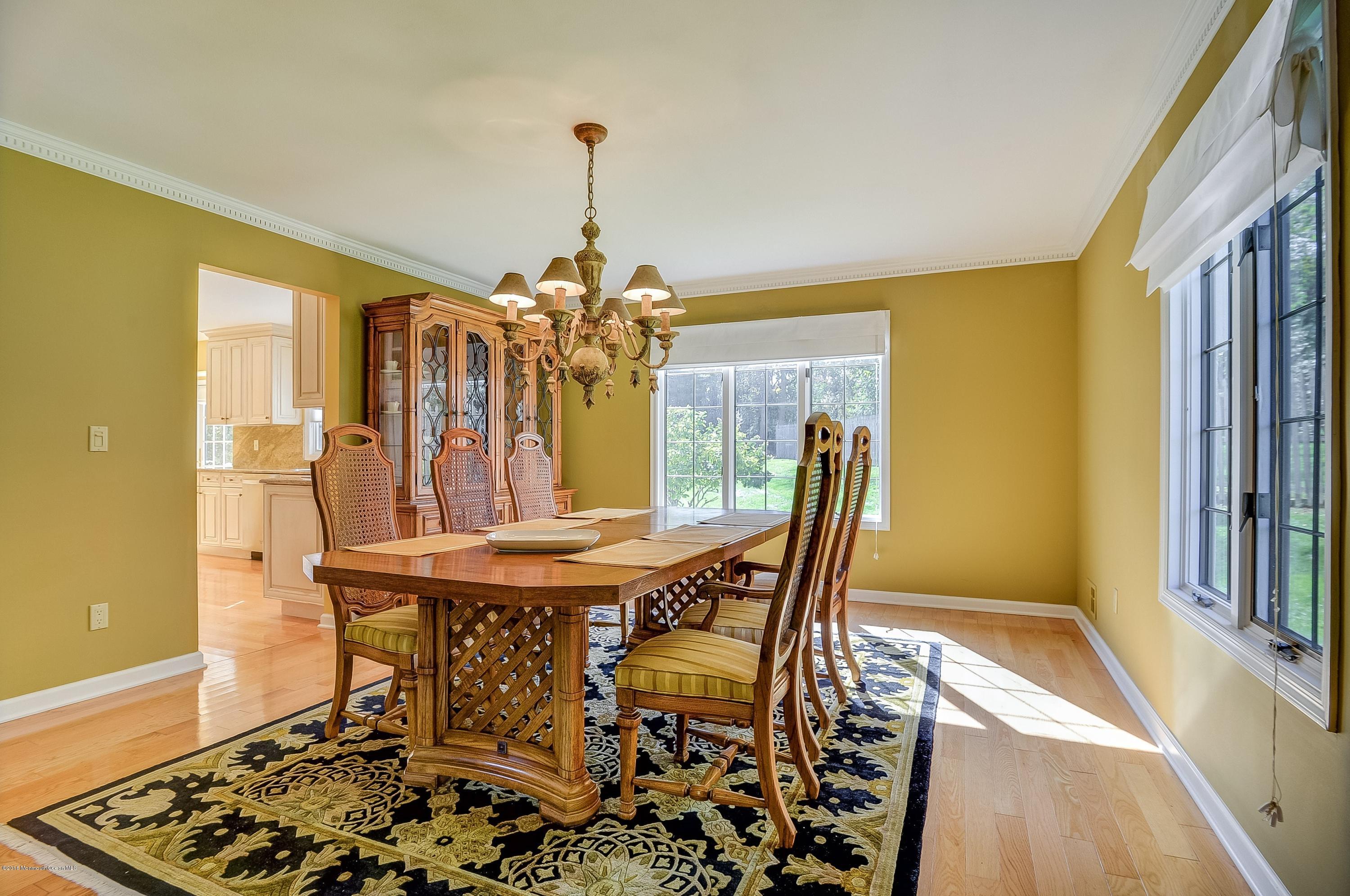 490 Burlington Road Freehold, NJ 07728 - Photo 11 of 34 a view of a dining room with furniture and wooden floor
