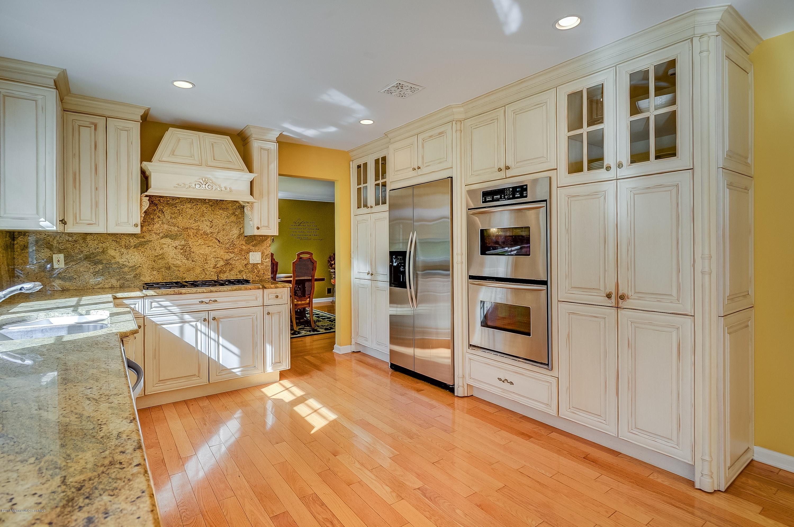 490 Burlington Road Freehold, NJ 07728 - Photo 16 of 34 a kitchen with stainless steel appliances granite countertop a refrigerator and a sink