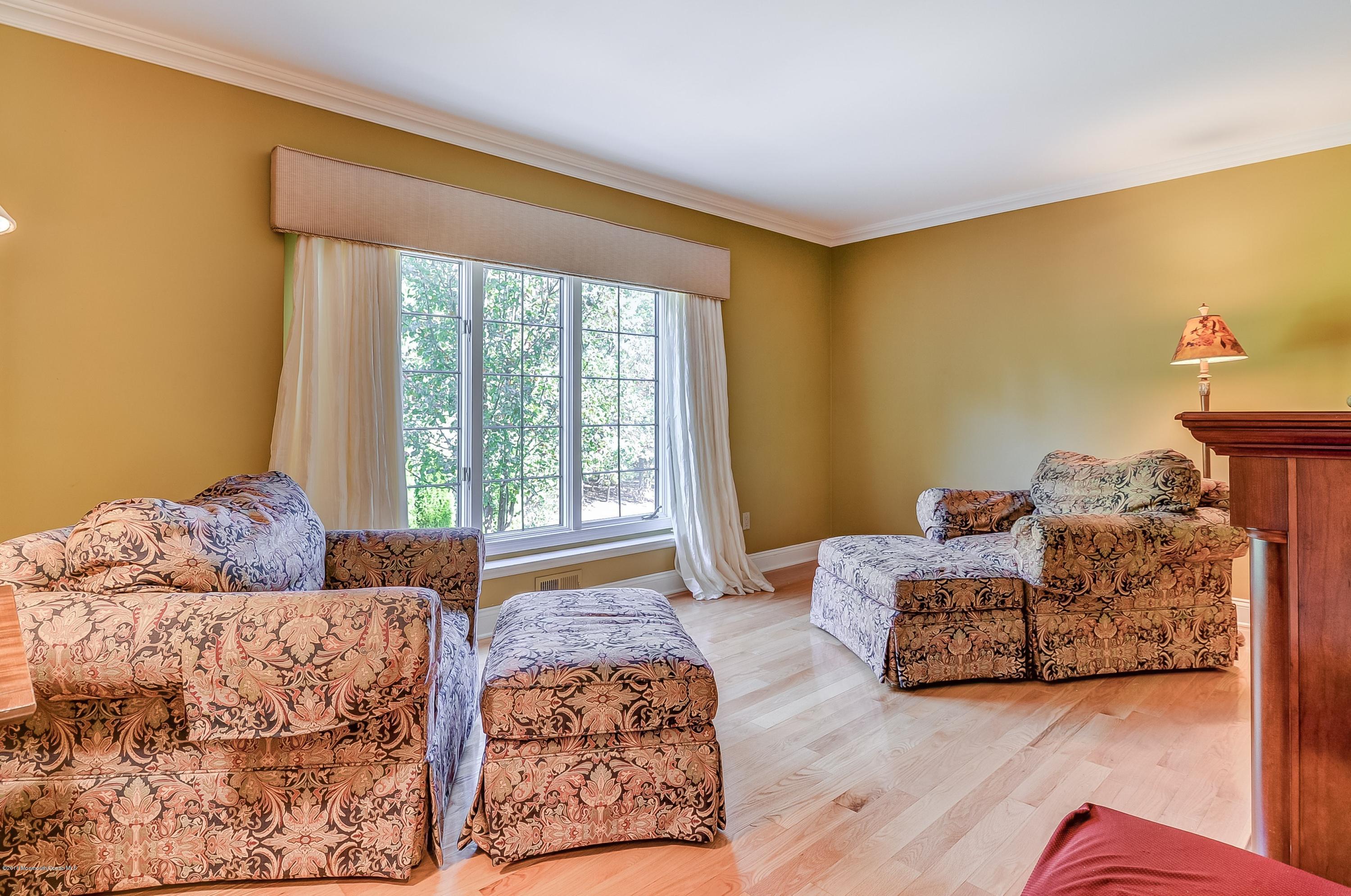 490 Burlington Road Freehold, NJ 07728 - Photo 17 of 34 a living room with furniture and a window