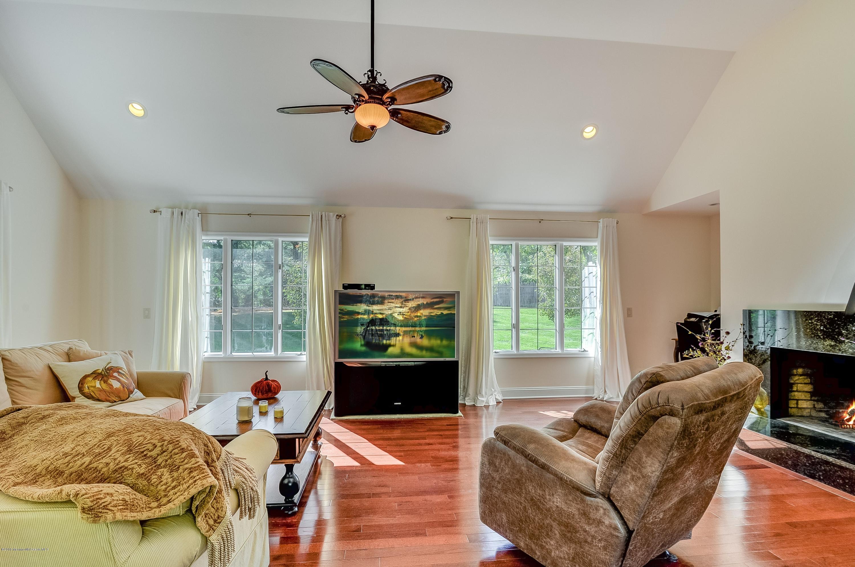490 Burlington Road Freehold, NJ 07728 - Photo 19 of 34 a living room with furniture and a window