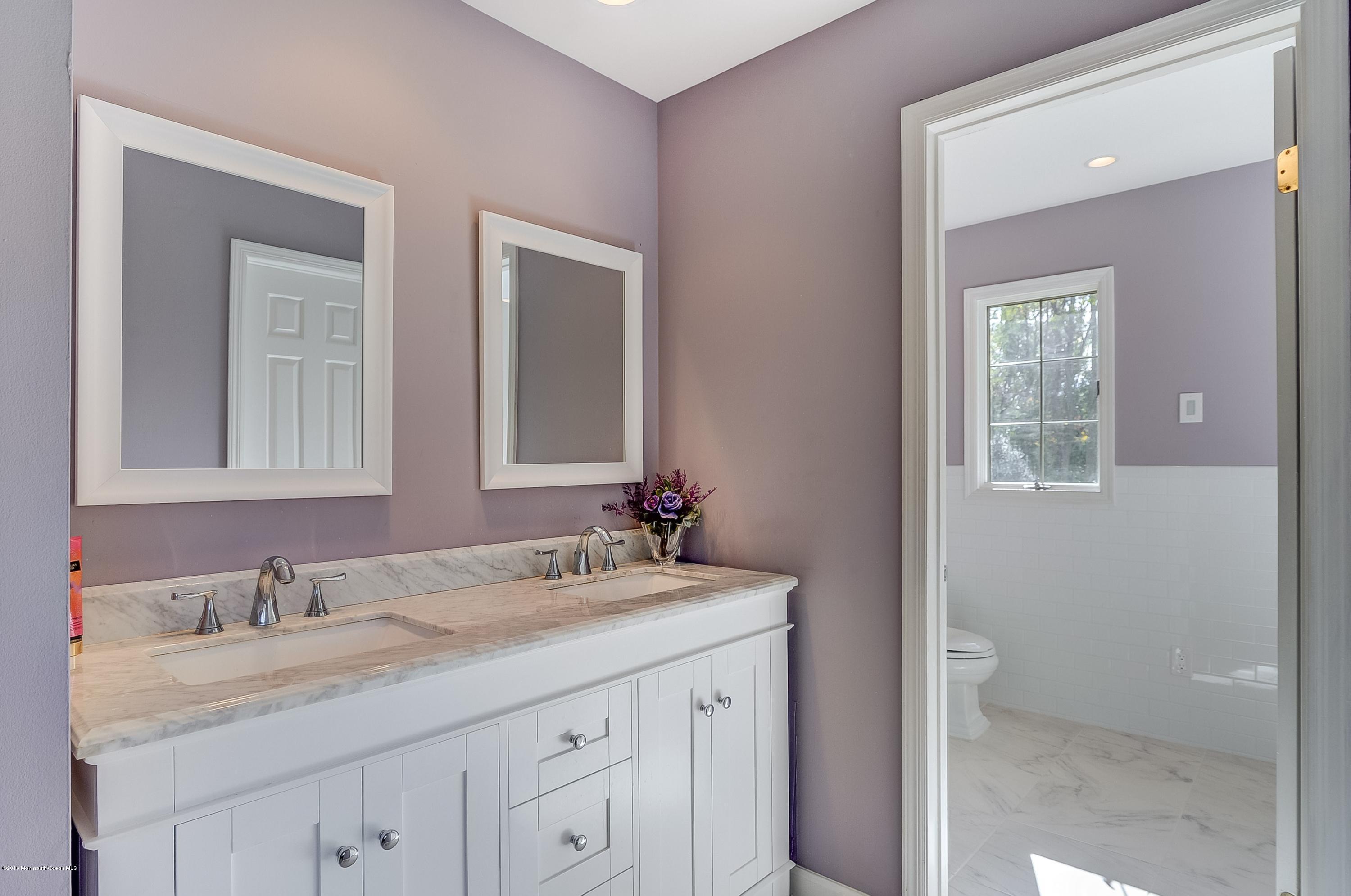 490 Burlington Road Freehold, NJ 07728 - Photo 23 of 34 a bathroom with a granite countertop sink and a mirror