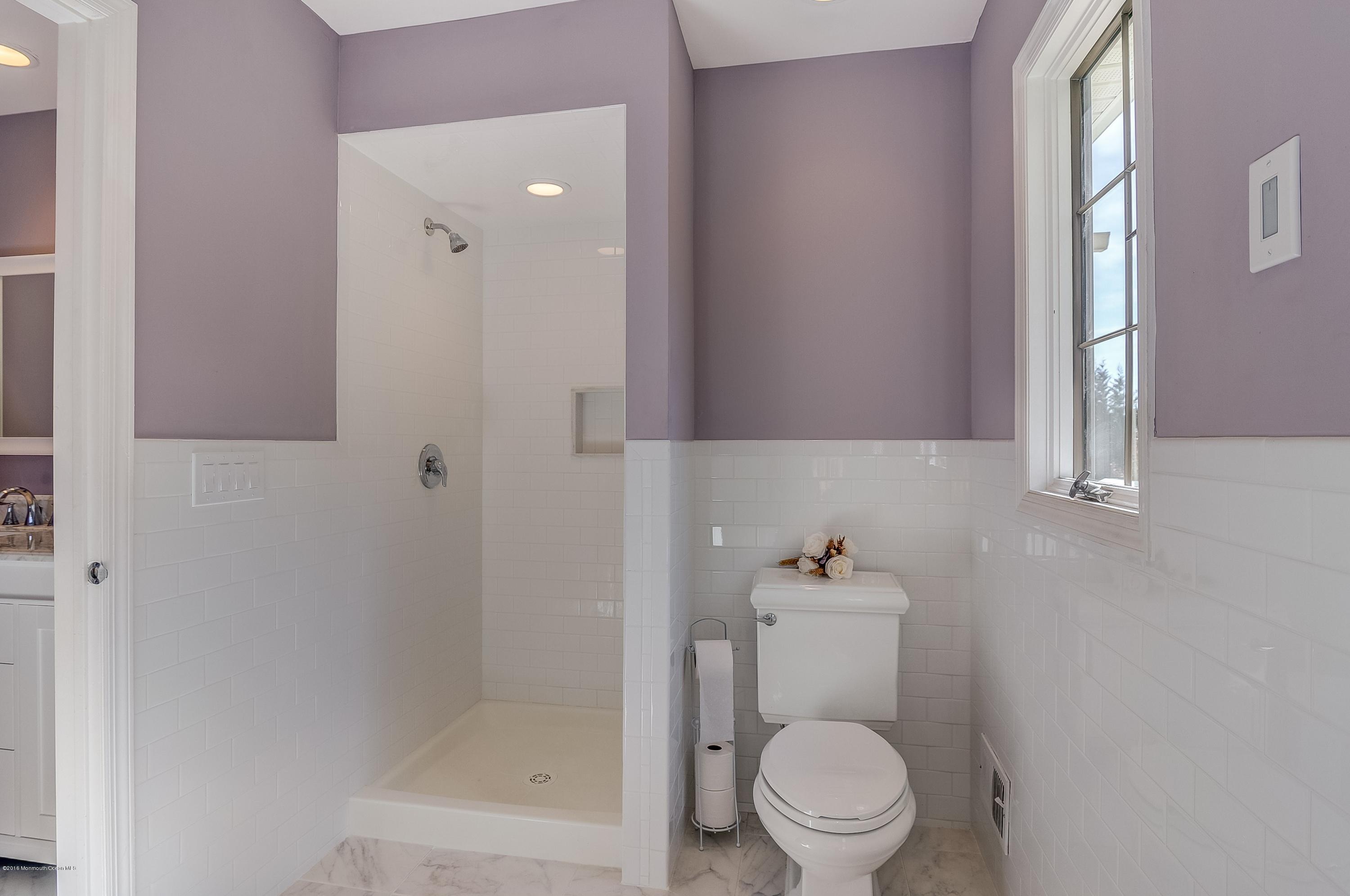 490 Burlington Road Freehold, NJ 07728 - Photo 25 of 34 a white toilet sitting next to a bathroom sink