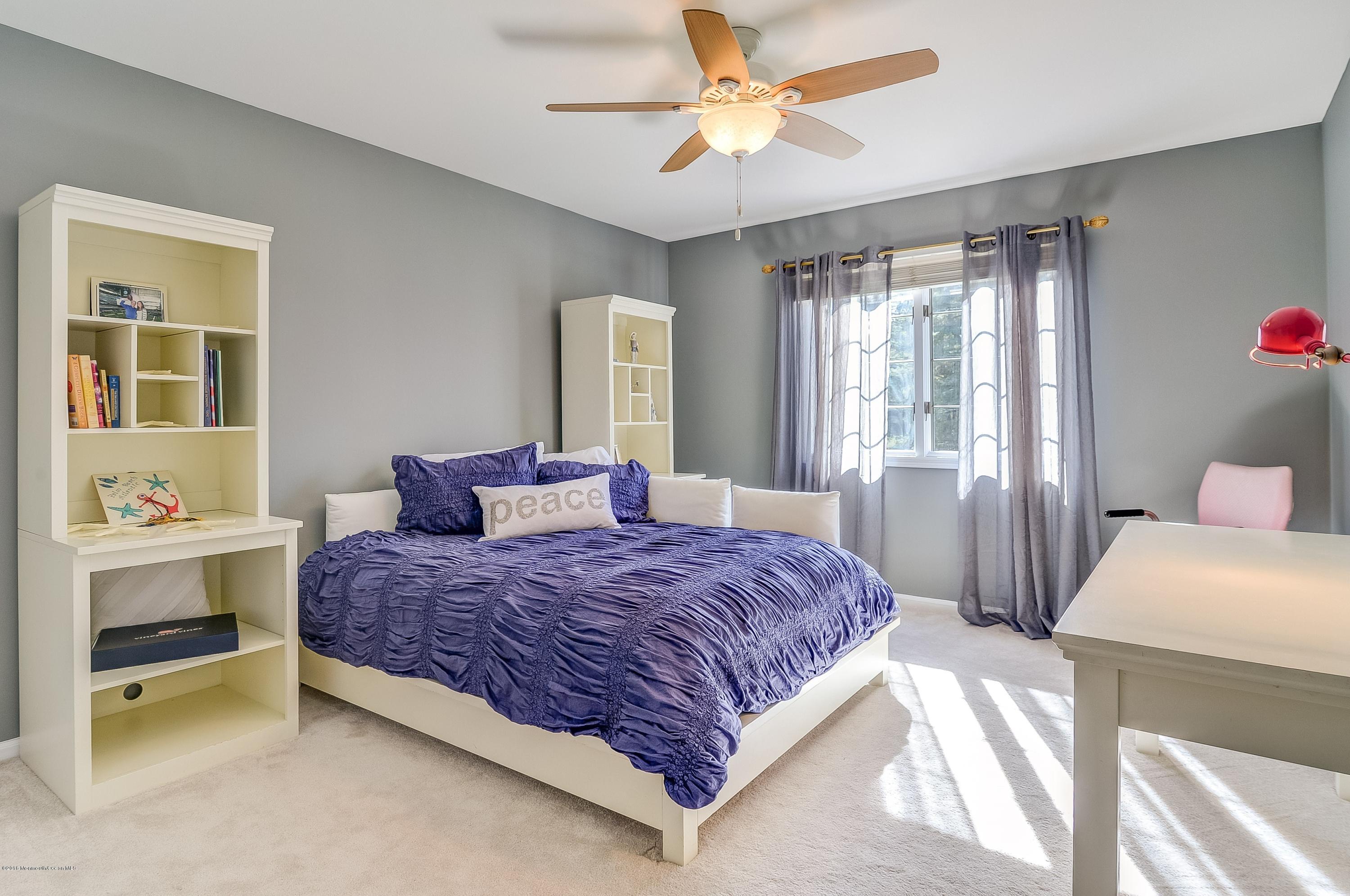 490 Burlington Road Freehold, NJ 07728 - Photo 28 of 34 a bedroom with a bed and a window