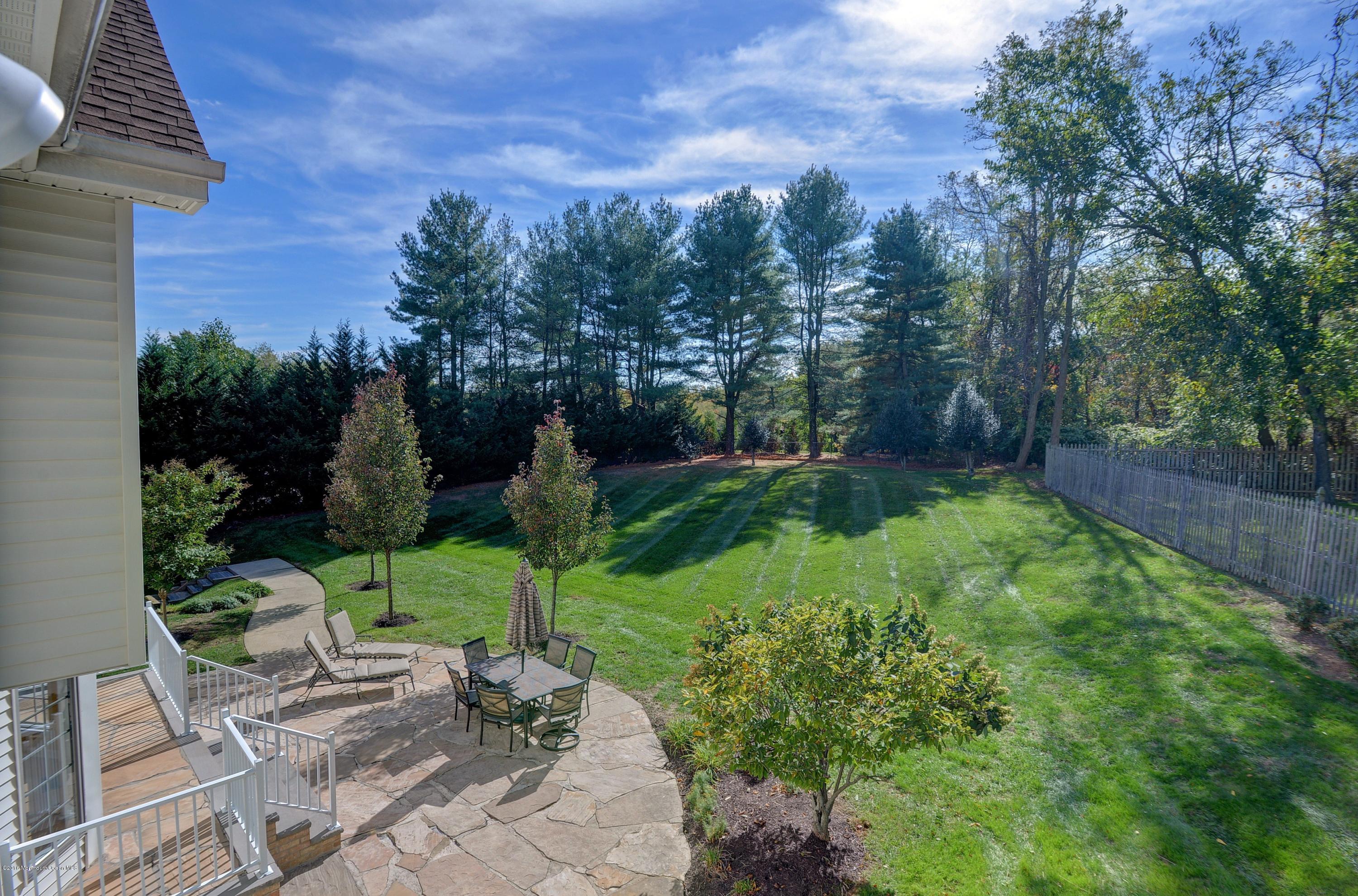490 Burlington Road Freehold, NJ 07728 - Photo 30 of 34 a view of a chair and table in backyard of the house
