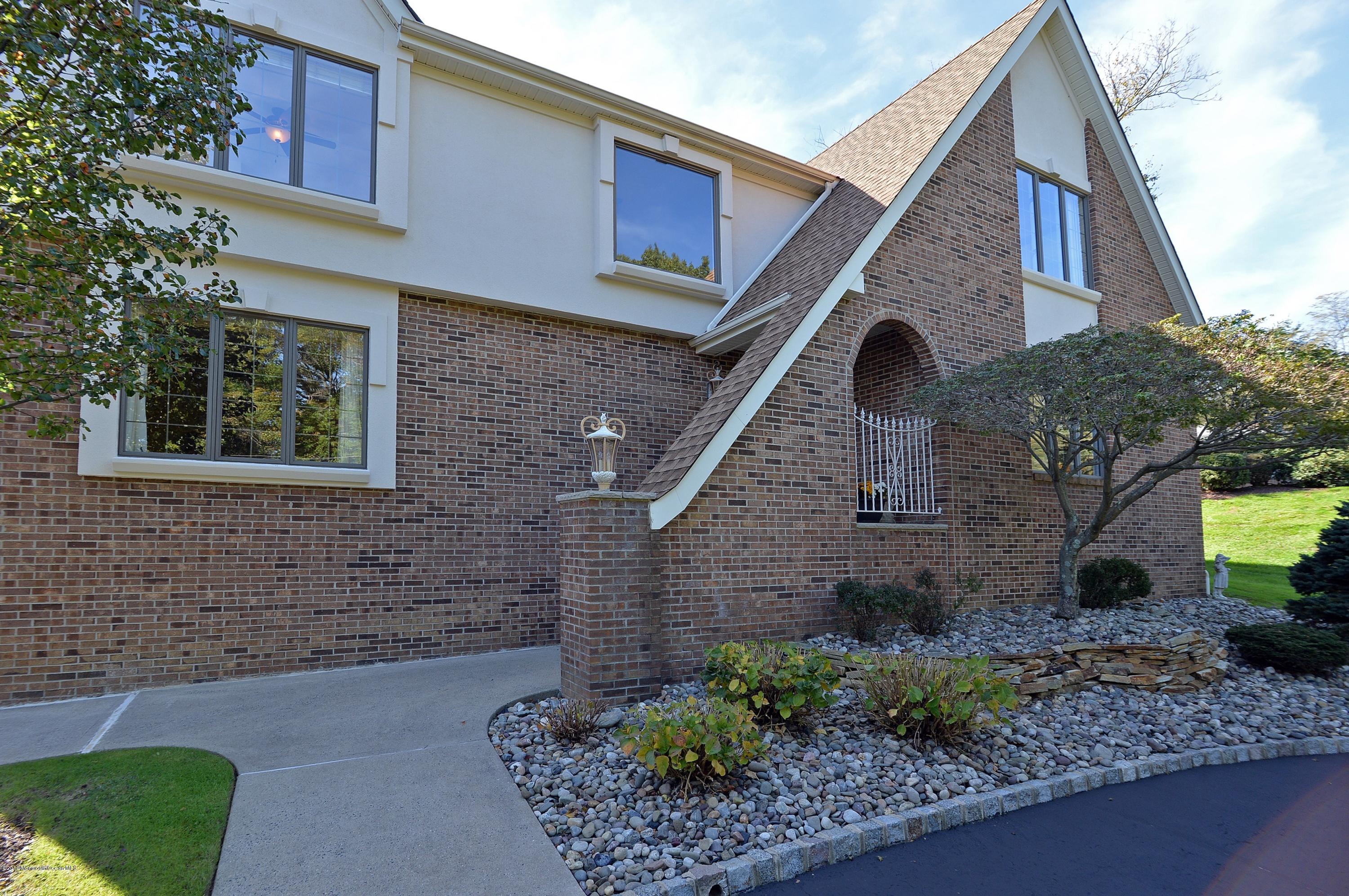 490 Burlington Road Freehold, NJ 07728 - Photo 3 of 34 a front view of a house with garden