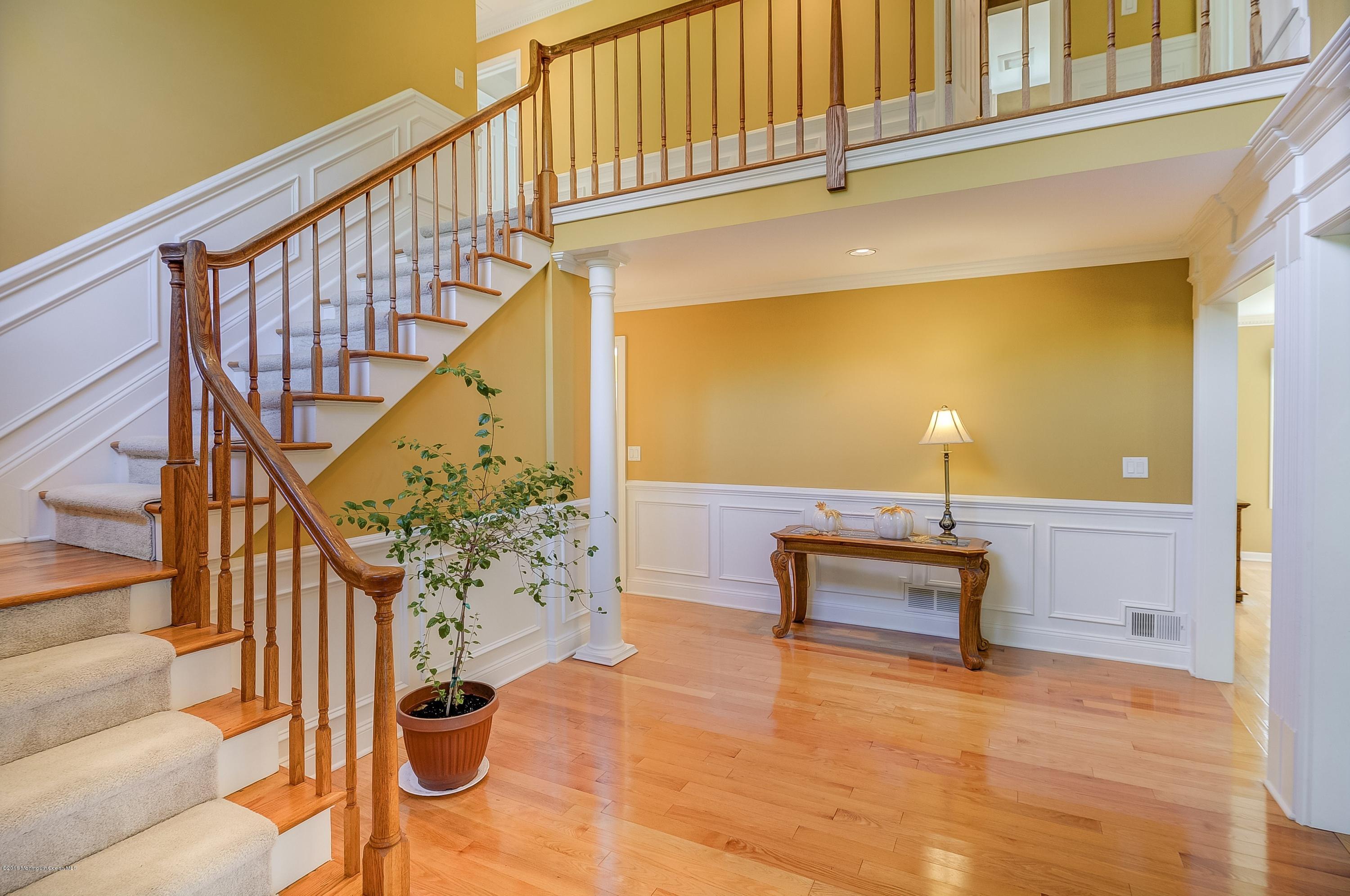 490 Burlington Road Freehold, NJ 07728 - Photo 5 of 34 a view of entryway livingroom and hall with wooden floor