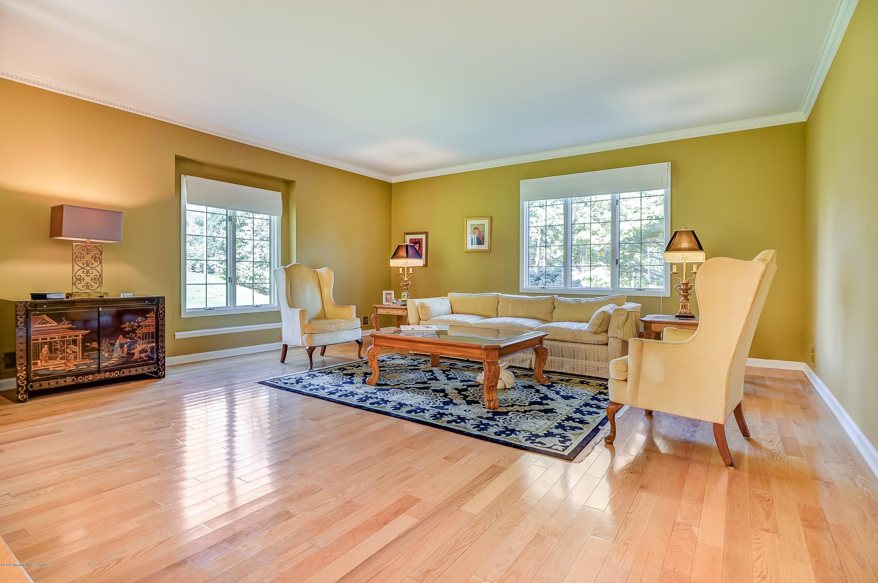 490 Burlington Road Freehold, NJ 07728 - Photo 7 of 34 a living room with furniture and a large window