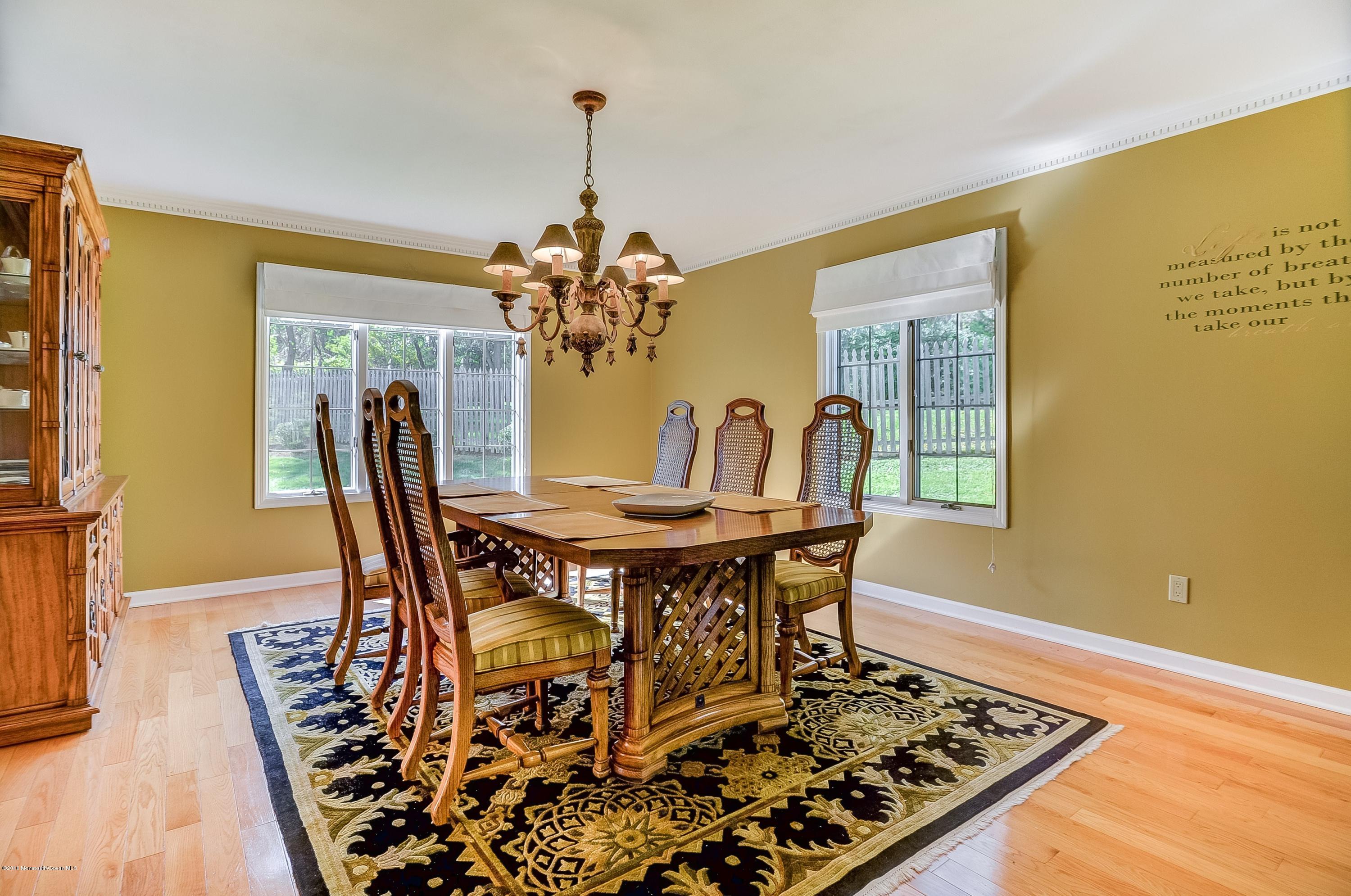 490 Burlington Road Freehold, NJ 07728 - Photo 10 of 34 a view of a dining room with furniture and wooden floor