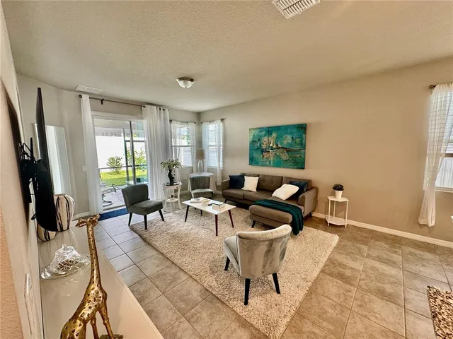 a kitchen with stainless steel appliances granite countertop a sink and a refrigerator