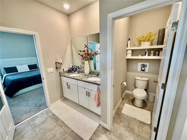 a view of a bathroom with a tub and shower