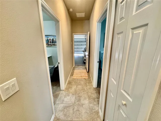 a bedroom with a bed and a mirror