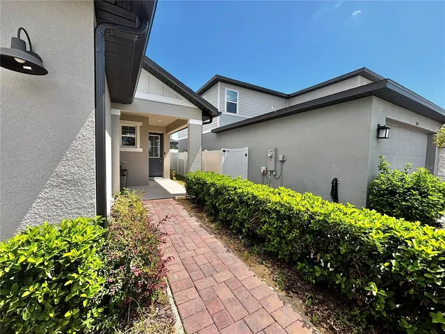 a backyard of a house with lots of green space