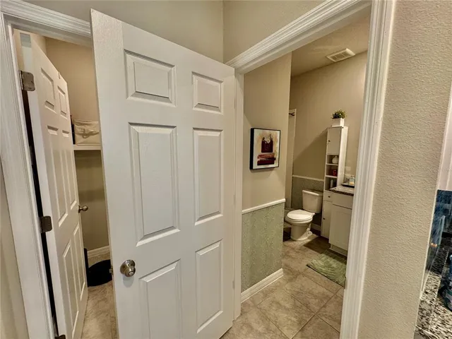 a bedroom with a bed and a shower